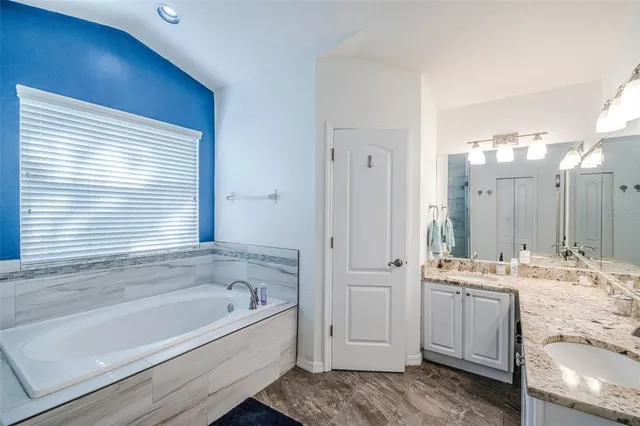 a room with furniture and a large window