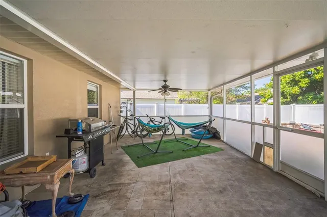 a view of a backyard with a swimming pool