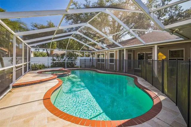 a view of a house with a backyard porch and sitting area