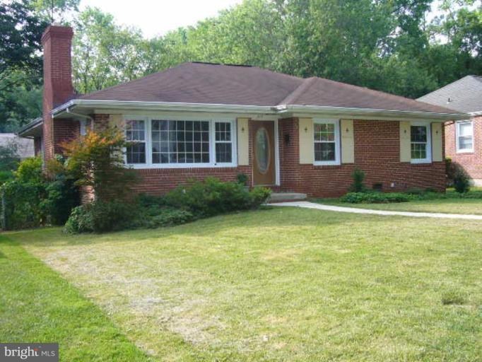 317 Worthington Road Towson, MD 21286 - Photo 1 of 14 a front view of a house with a garden and yard