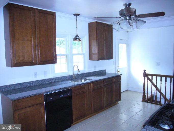 317 Worthington Road Towson, MD 21286 - Photo 3 of 14 a kitchen with a sink and cabinets