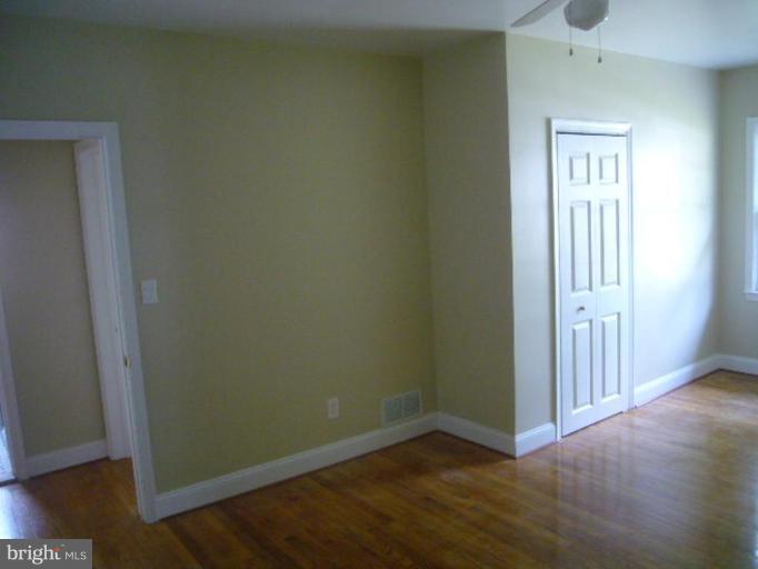 317 Worthington Road Towson, MD 21286 - Photo 5 of 14 an empty room with wooden floor