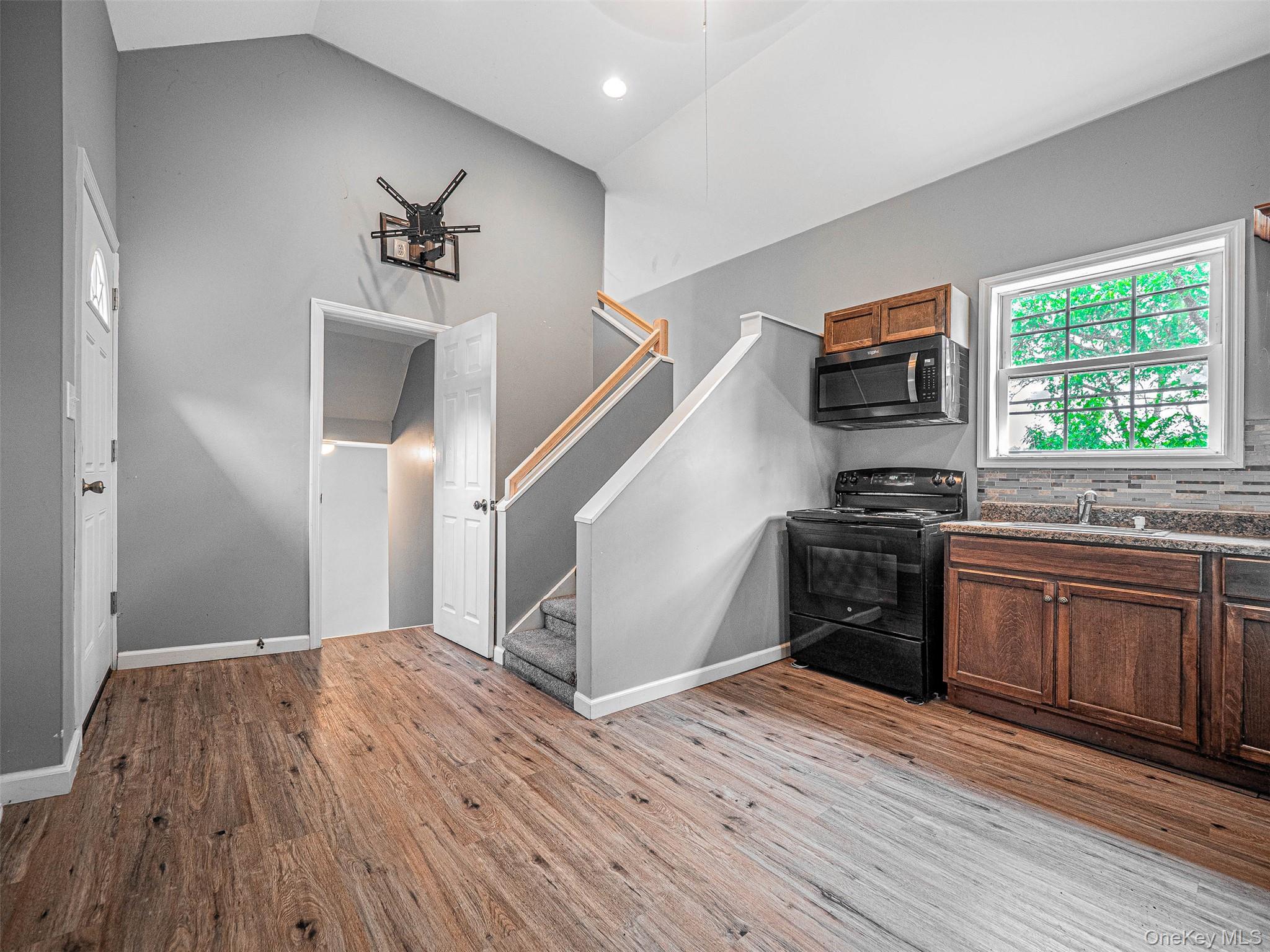 784 County Rte 12 New Hampton, NY 10958 - Photo 11 of 19 a kitchen with a wooden floor and a stove top oven