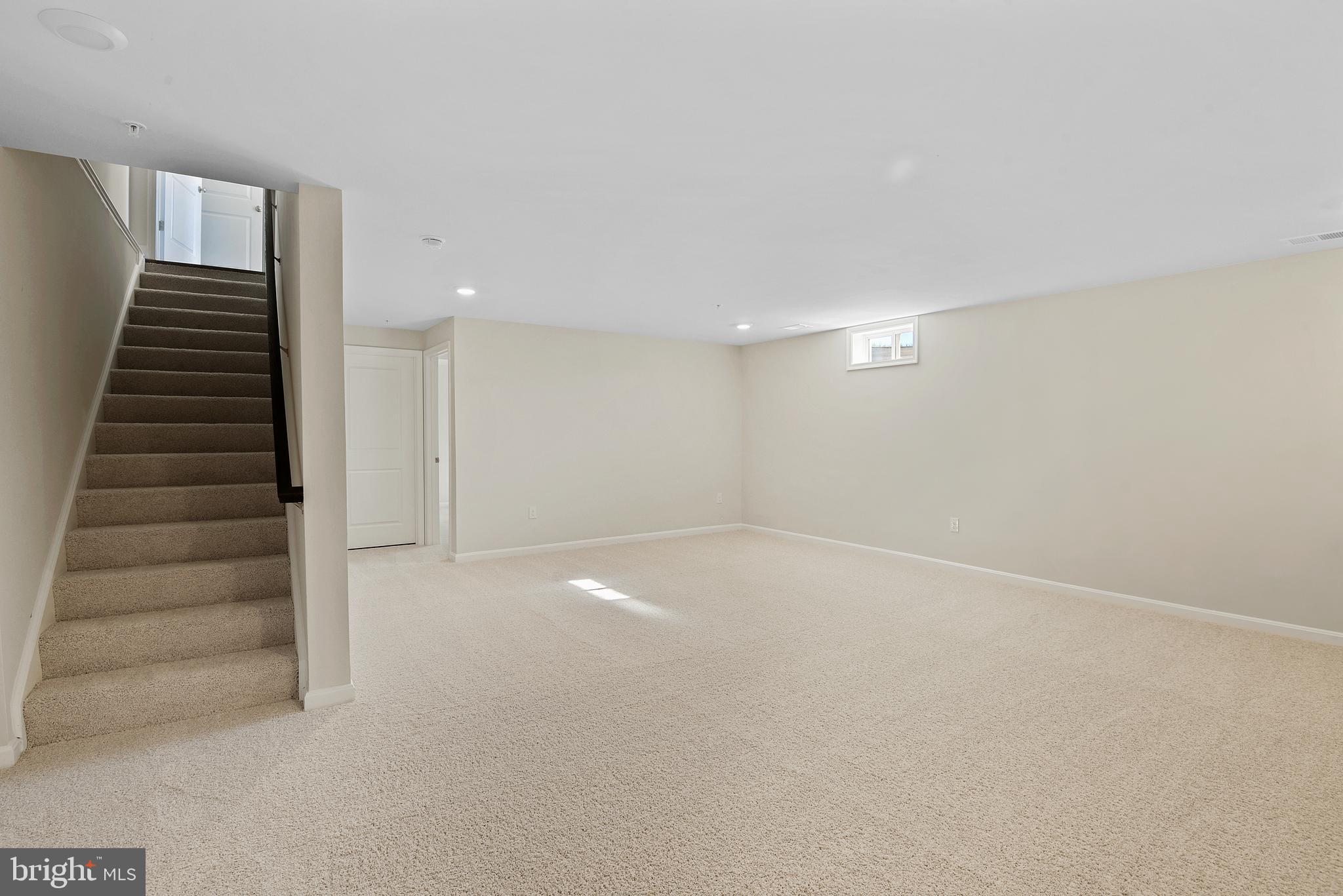 475 Ensemble Way Frederick, MD 21701 - Photo 23 of 25 a view of an empty room with stairs