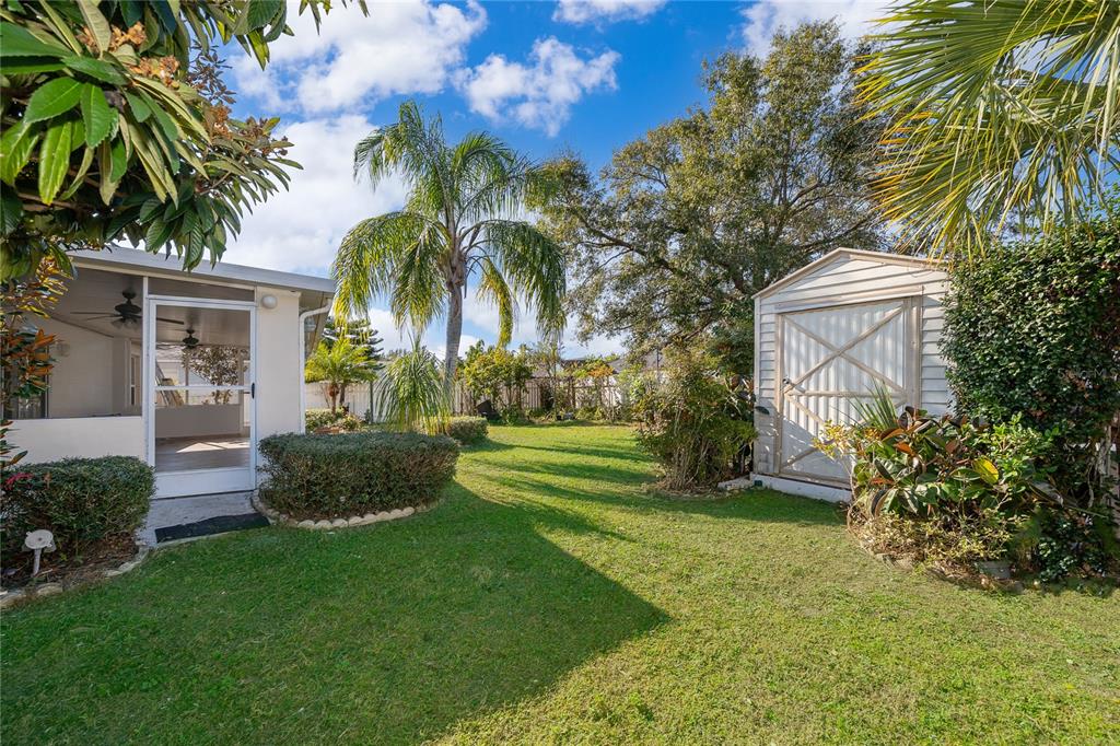 611 Baldwin Drive Kissimmee, FL 34758 - Photo 21 of 26 a front view of a house with garden