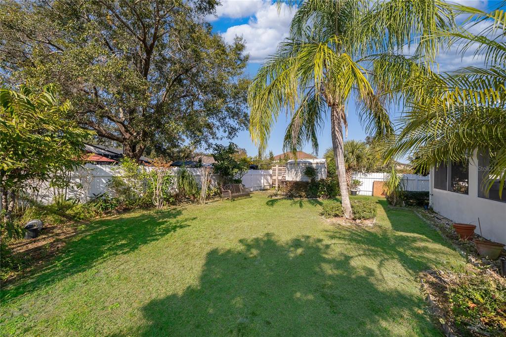 611 Baldwin Drive Kissimmee, FL 34758 - Photo 22 of 26 a view of a yard in front of the house