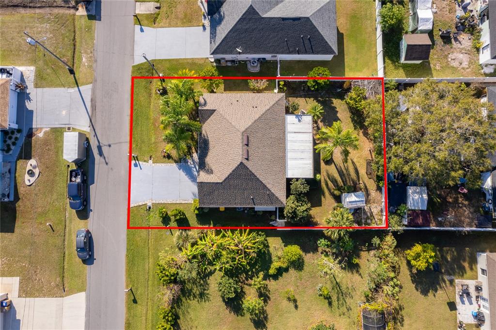 611 Baldwin Drive Kissimmee, FL 34758 - Photo 24 of 26 aerial view of a house with a yard and sitting area