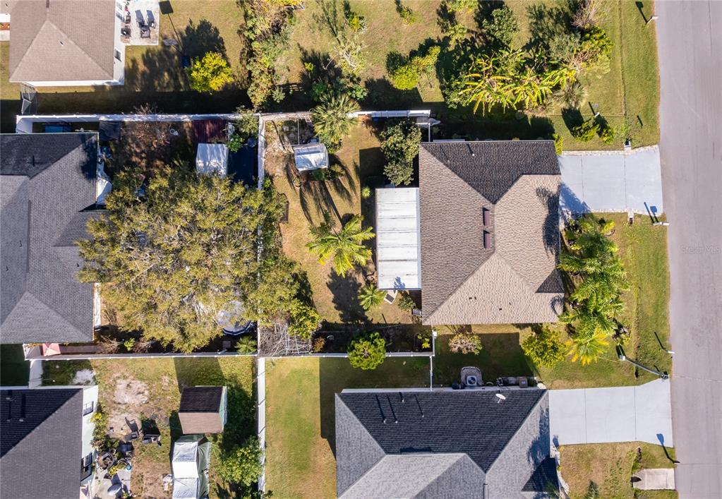611 Baldwin Drive Kissimmee, FL 34758 - Photo 26 of 26 aerial view of a house with a yard