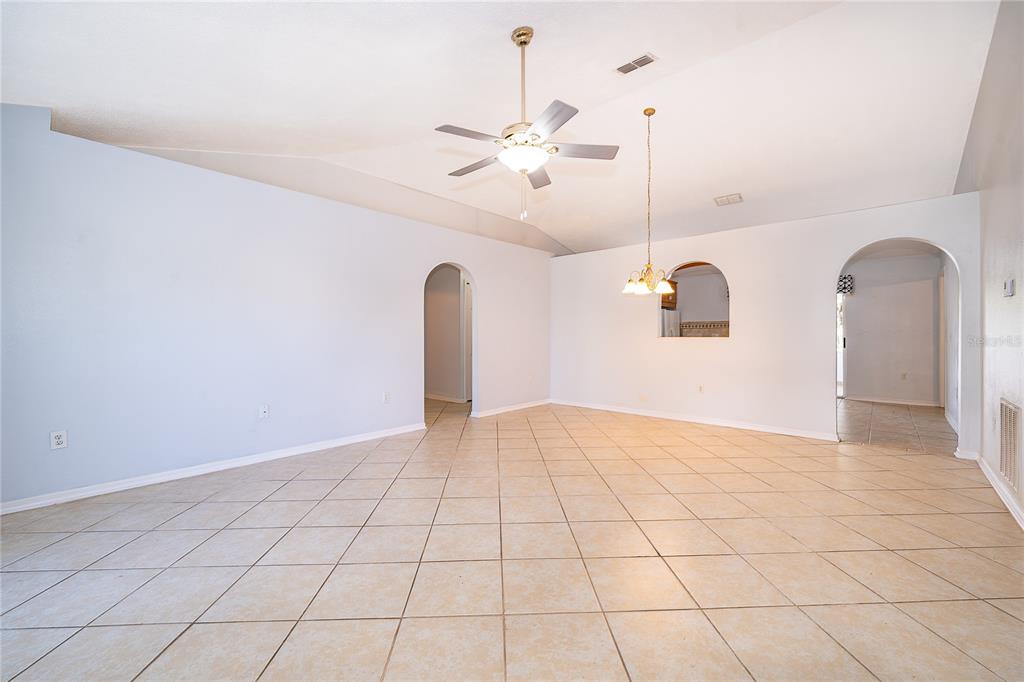 611 Baldwin Drive Kissimmee, FL 34758 - Photo 4 of 26 a view of an empty room and chandelier fan