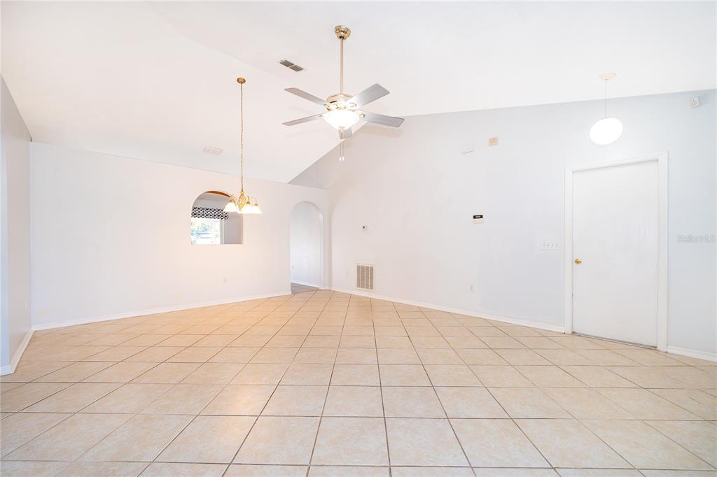 611 Baldwin Drive Kissimmee, FL 34758 - Photo 5 of 26 a view of an empty room and a window