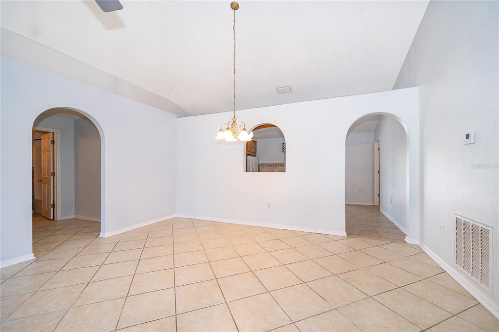 611 Baldwin Drive Kissimmee, FL 34758 - Photo 8 of 26 a view of an empty room with windows