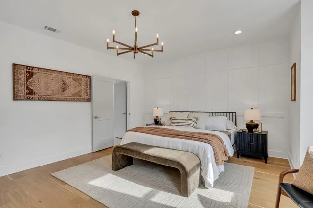 a bedroom with a bed and cabinets