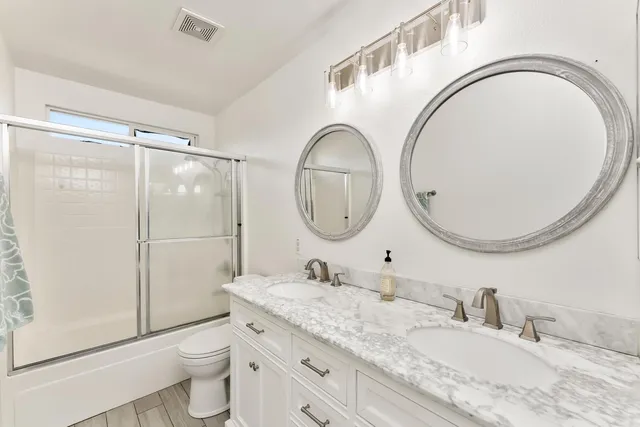 a bedroom with a bed dresser and a window