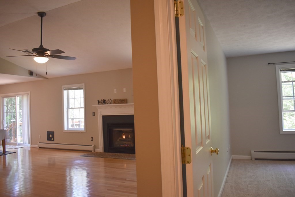 32 Jericho Road Rindge, NH 03461 - Photo 12 of 37 a view of an empty room with a window and a kitchen