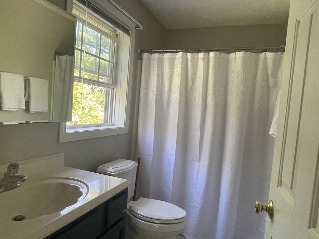 32 Jericho Road Rindge, NH 03461 - Photo 14 of 37 a bathroom with a sink and a toilet