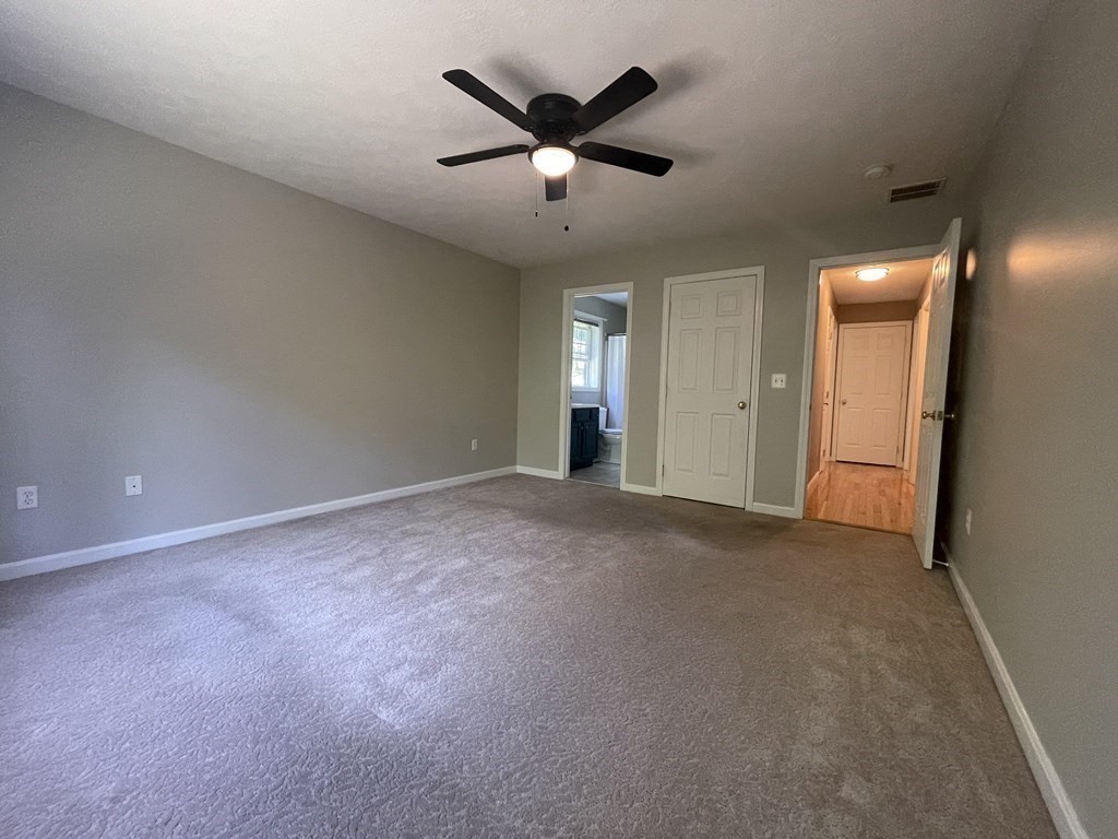 32 Jericho Road Rindge, NH 03461 - Photo 15 of 37 an empty room with closet and ceiling fan
