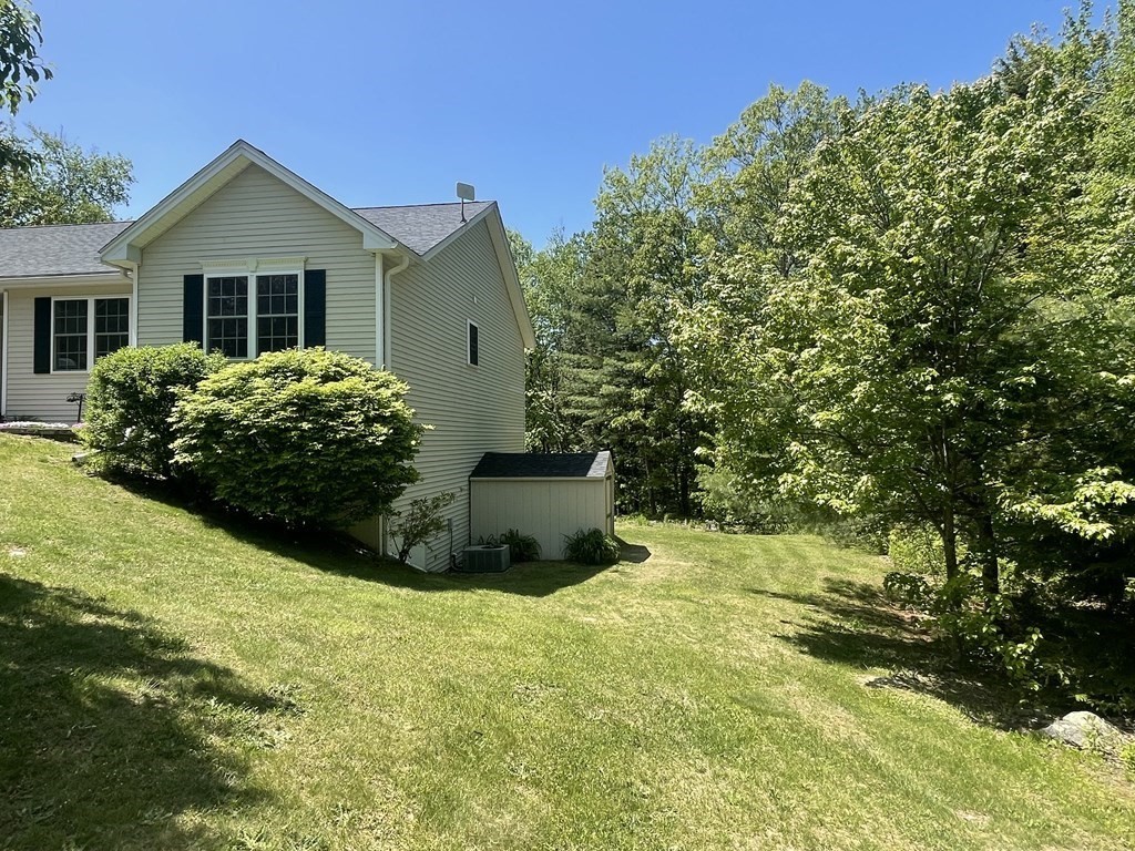 32 Jericho Road Rindge, NH 03461 - Photo 2 of 37 a view of a house with a garden