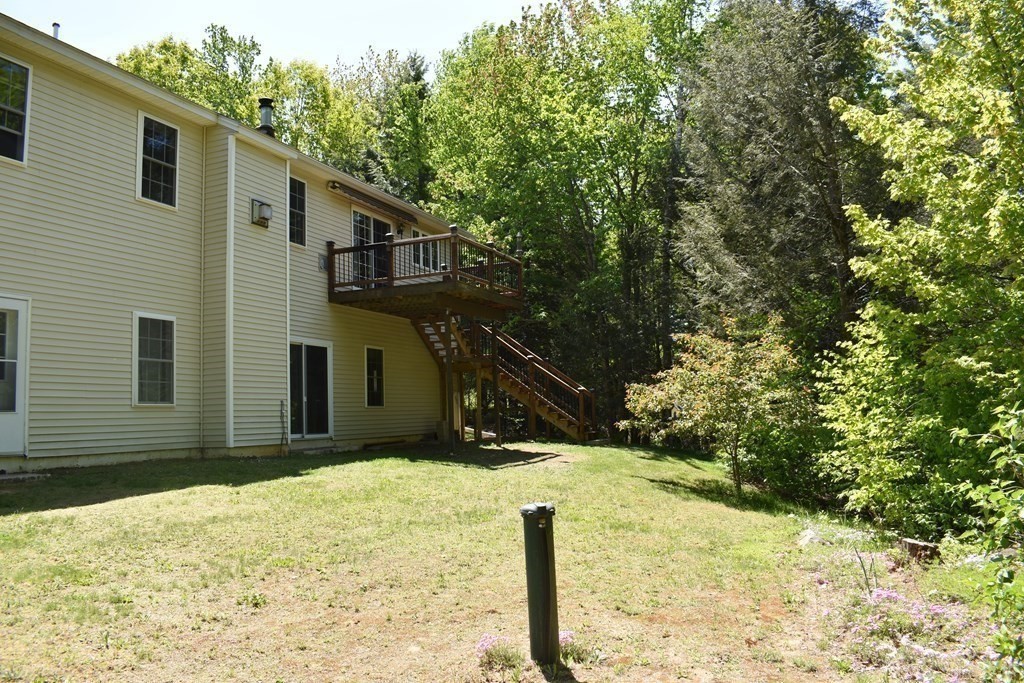 32 Jericho Road Rindge, NH 03461 - Photo 33 of 37 a view of a house with a yard