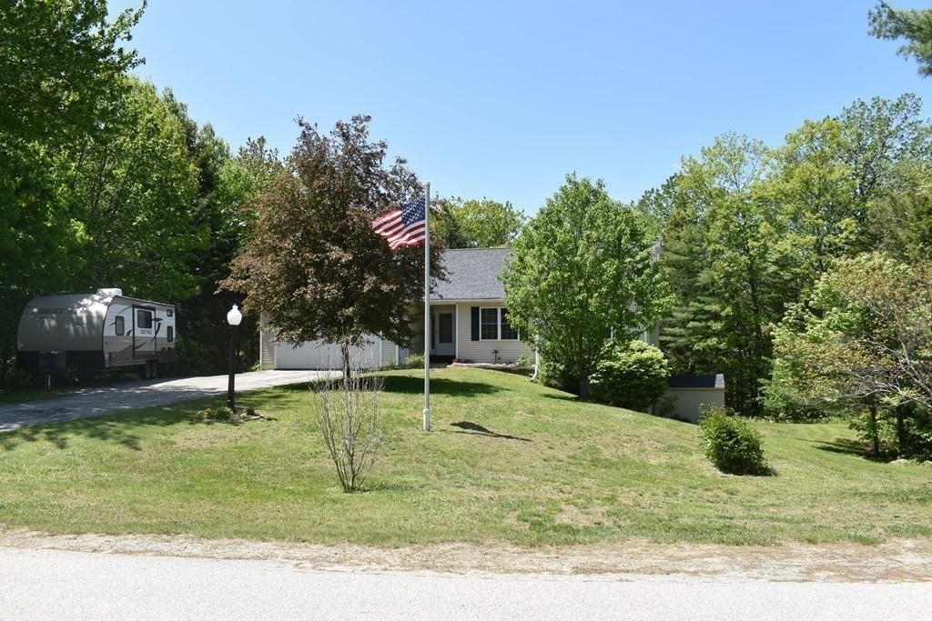 32 Jericho Road Rindge, NH 03461 - Photo 37 of 37 a garden with trees in the background