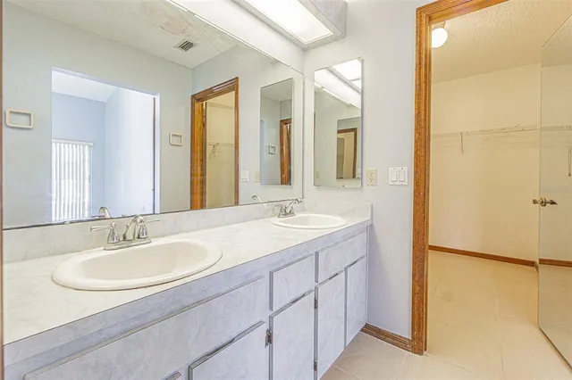 a bathroom with a shower a toilet and a window