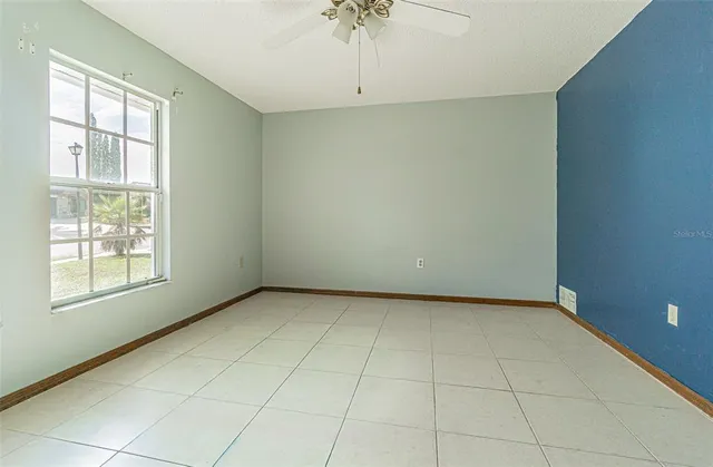 a view of an empty room with a window
