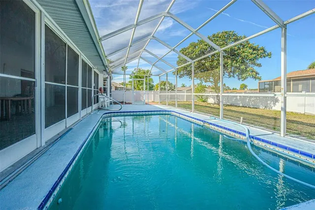a view of a swimming pool with a porch