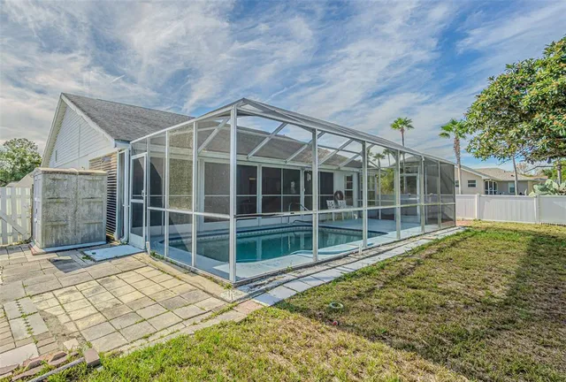 a view of a house with a backyard