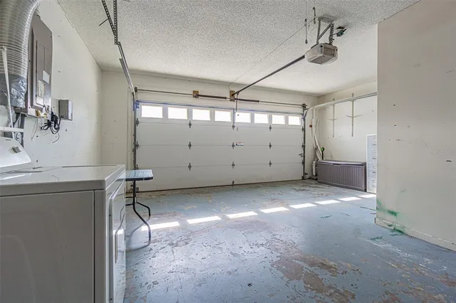 an aerial view of a house with a garden and pool