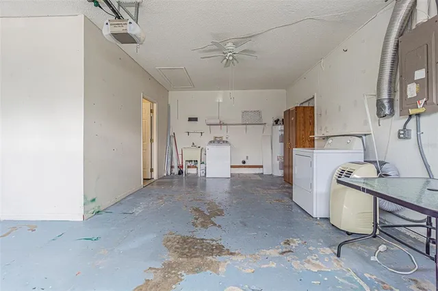 an aerial view of multiple houses with a yard