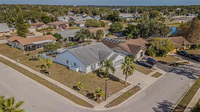 an aerial view of a house with a lake view