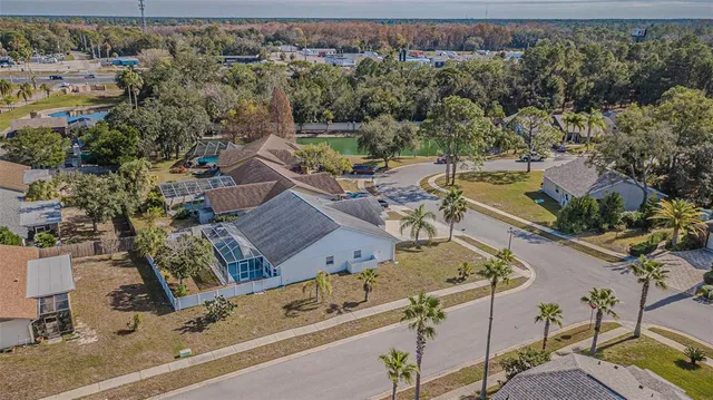 an aerial view of a house with outdoor space