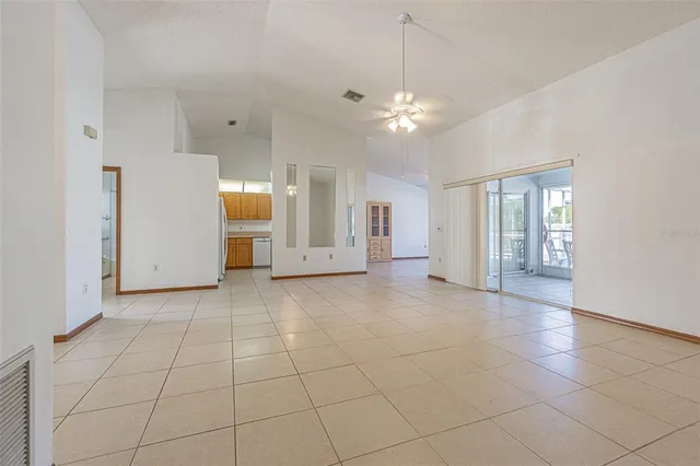 a view of a livingroom with a furniture and chandelier fan