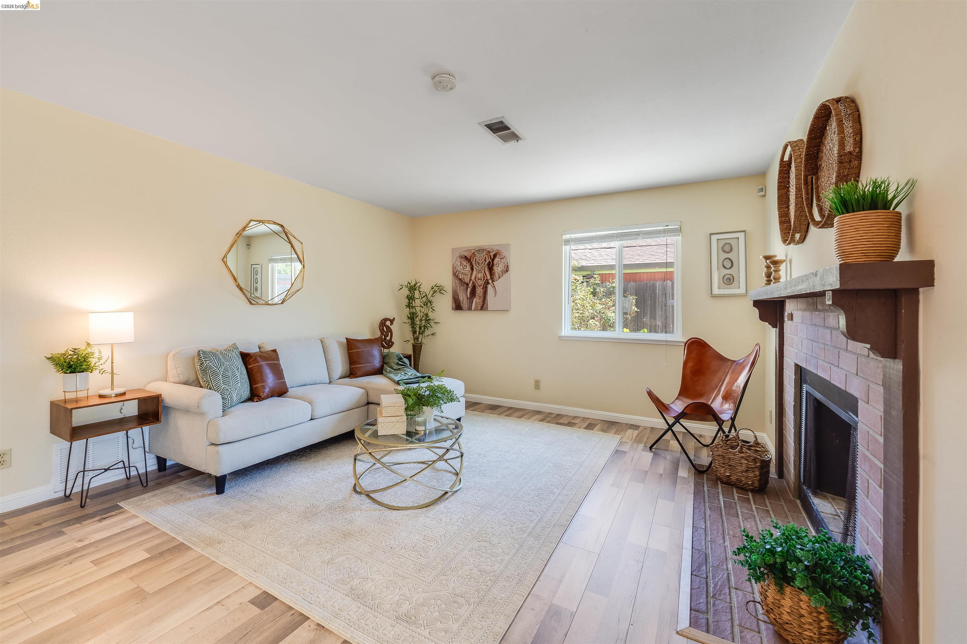 2142 Redwood Road Hercules, CA 94547 - Photo 14 of 37 Living area featuring light wood-style floors and a brick fireplace
