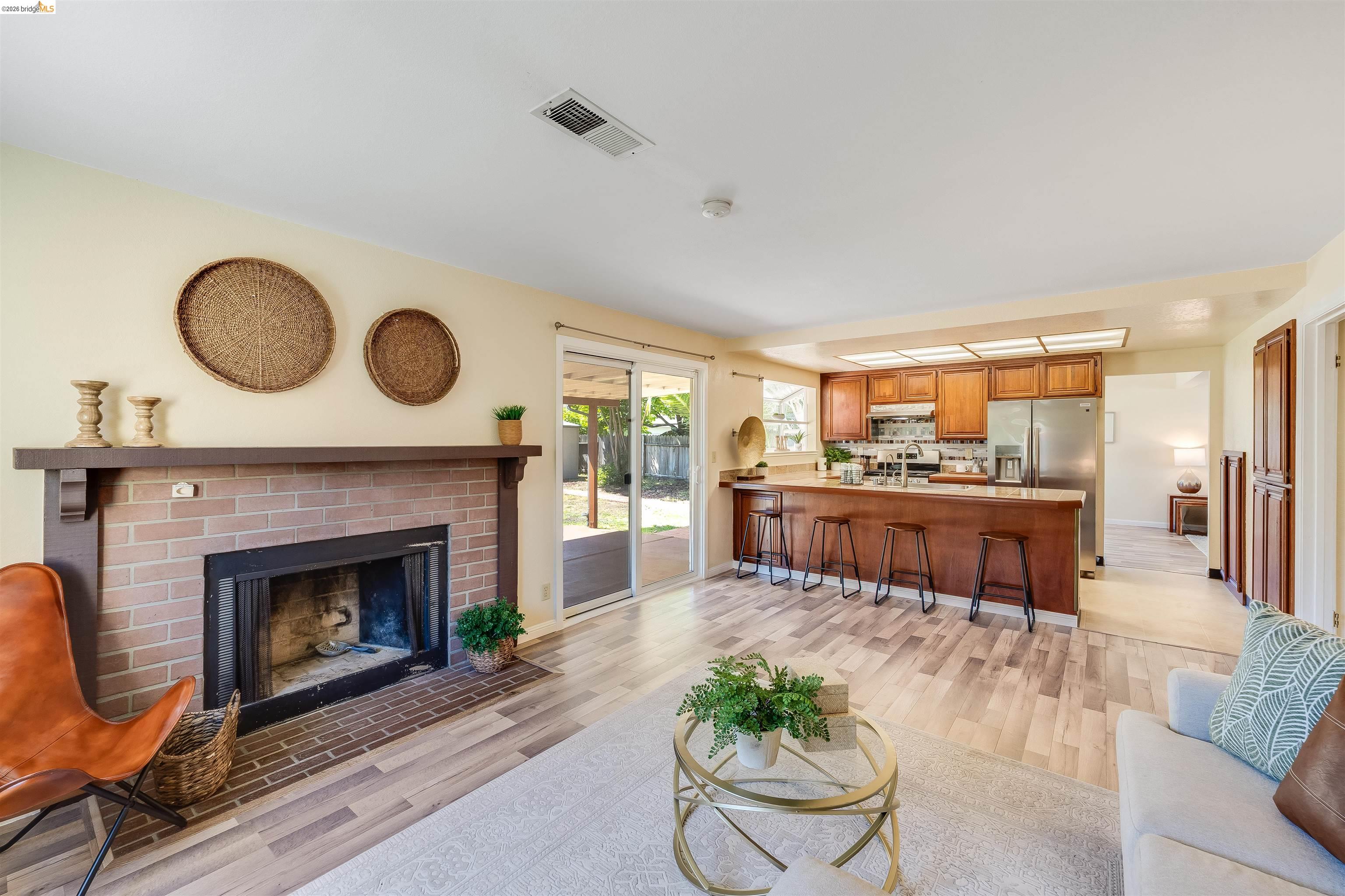 2142 Redwood Road Hercules, CA 94547 - Photo 15 of 37 Living area featuring light wood-type flooring and a brick fireplace