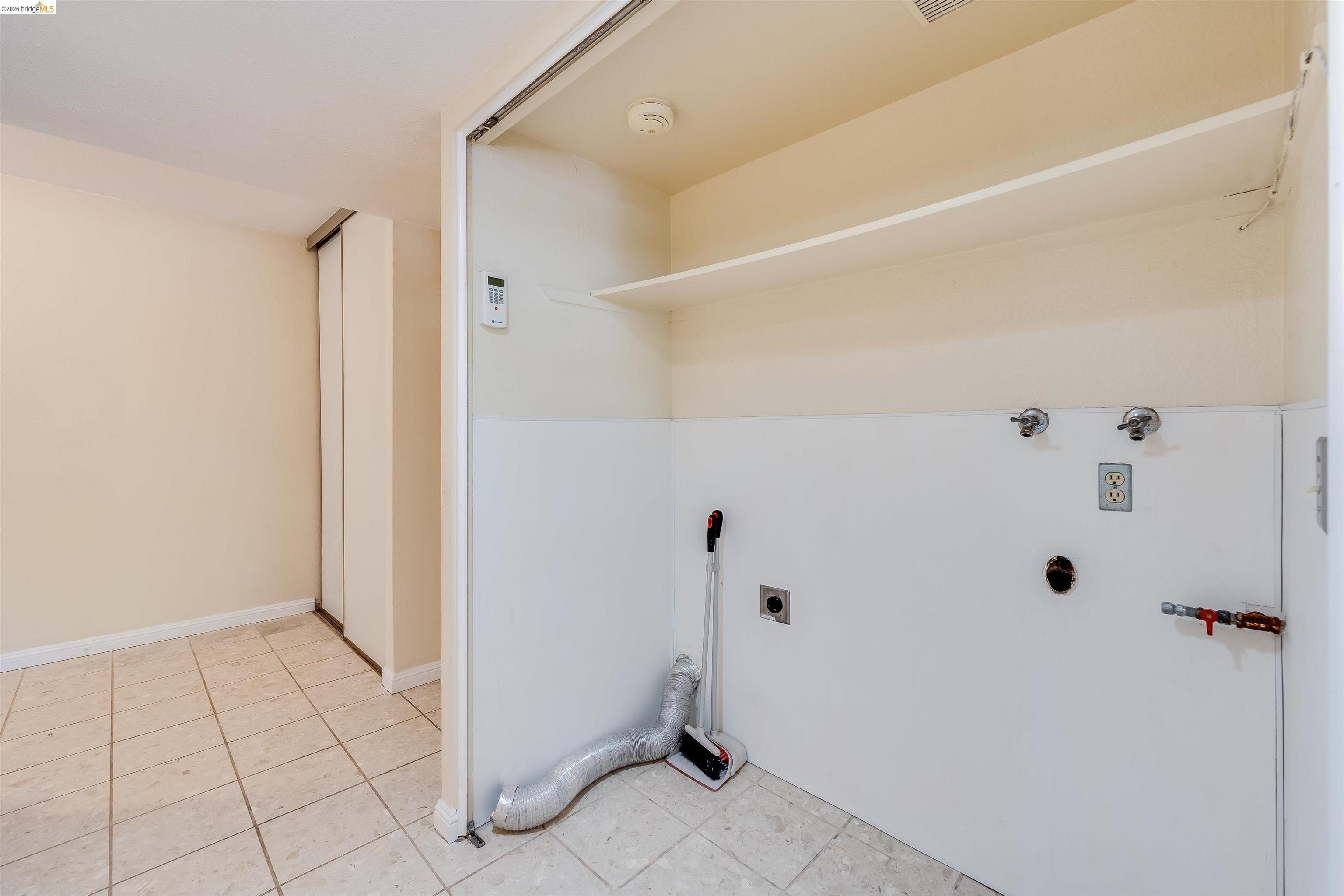 2142 Redwood Road Hercules, CA 94547 - Photo 16 of 37 Laundry area featuring hookup for an electric dryer, light tile patterned floors, and hookup for a washing machine