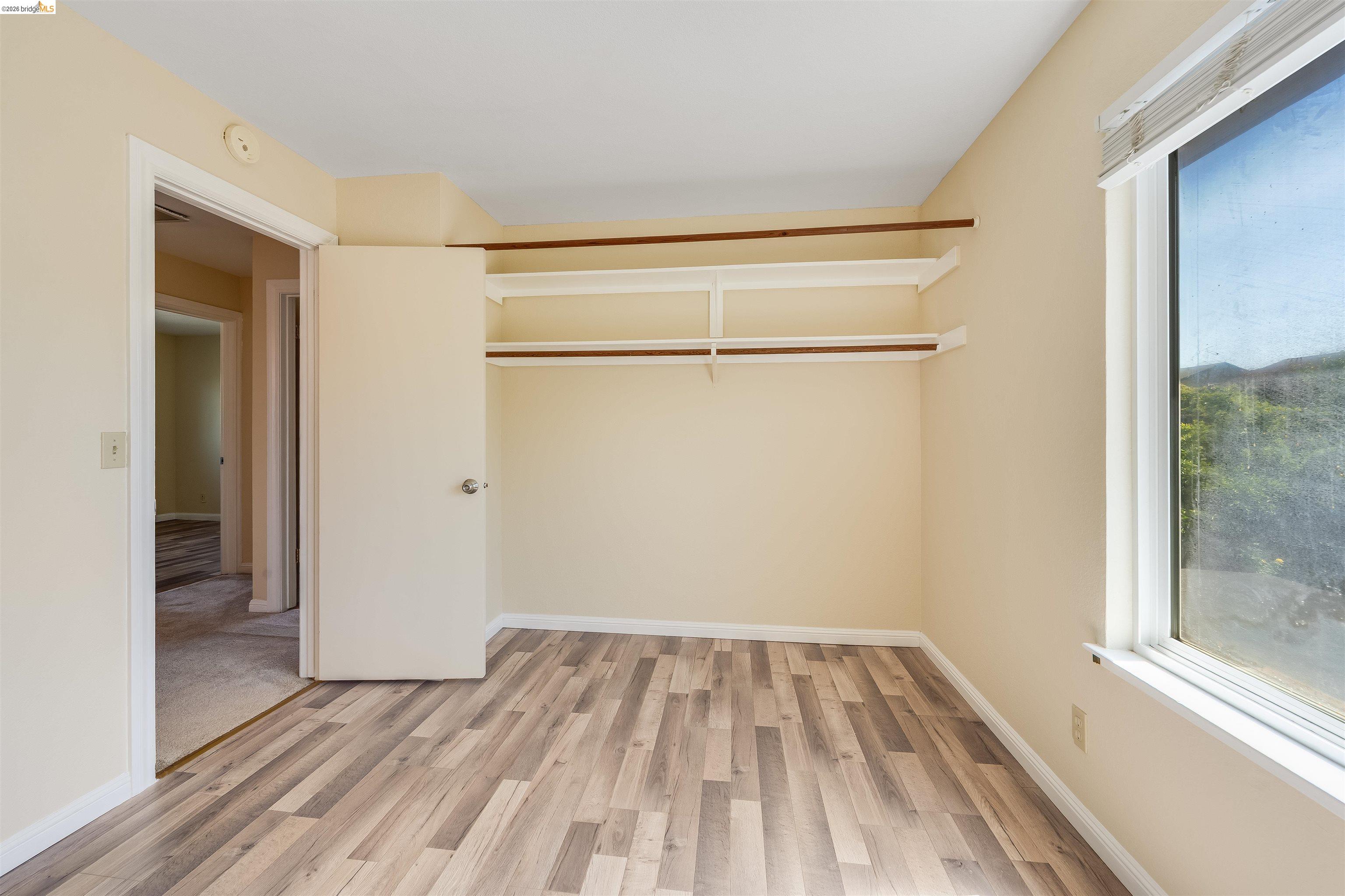 2142 Redwood Road Hercules, CA 94547 - Photo 18 of 37 Unfurnished bedroom with light wood-type flooring and baseboards