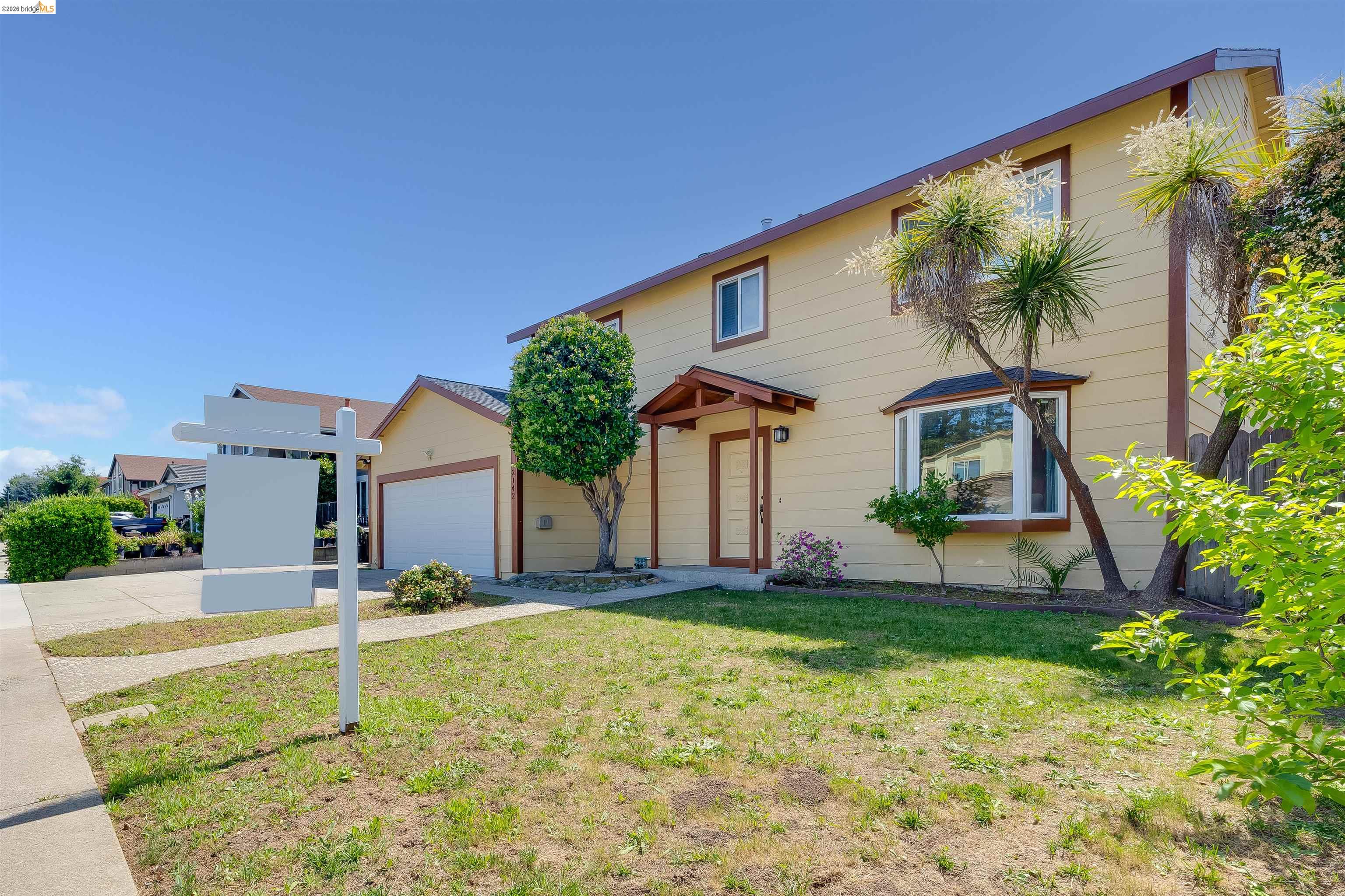 2142 Redwood Road Hercules, CA 94547 - Photo 2 of 37 View of front of property featuring a front yard, concrete driveway, and a garage