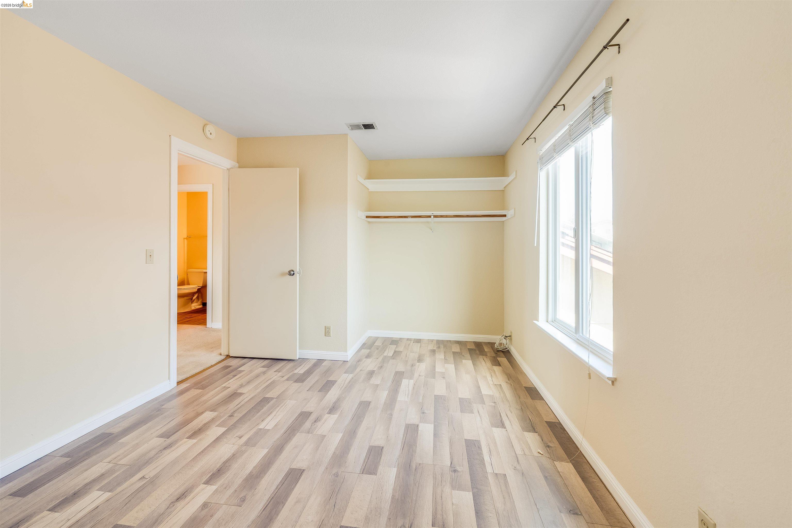 2142 Redwood Road Hercules, CA 94547 - Photo 20 of 37 Unfurnished bedroom featuring light wood-style flooring and a closet