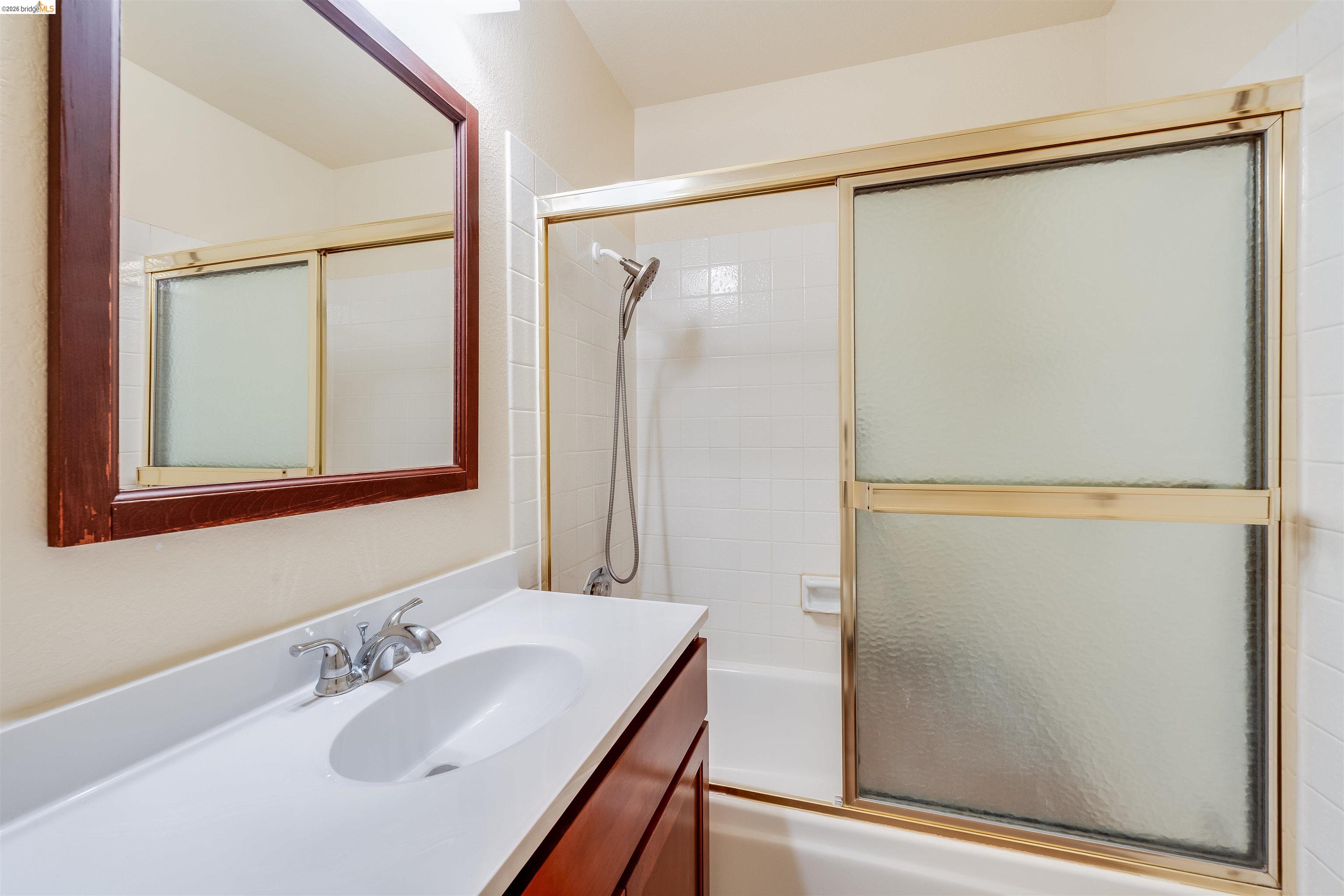 2142 Redwood Road Hercules, CA 94547 - Photo 22 of 37 Full bathroom with vanity and enclosed tub / shower combo