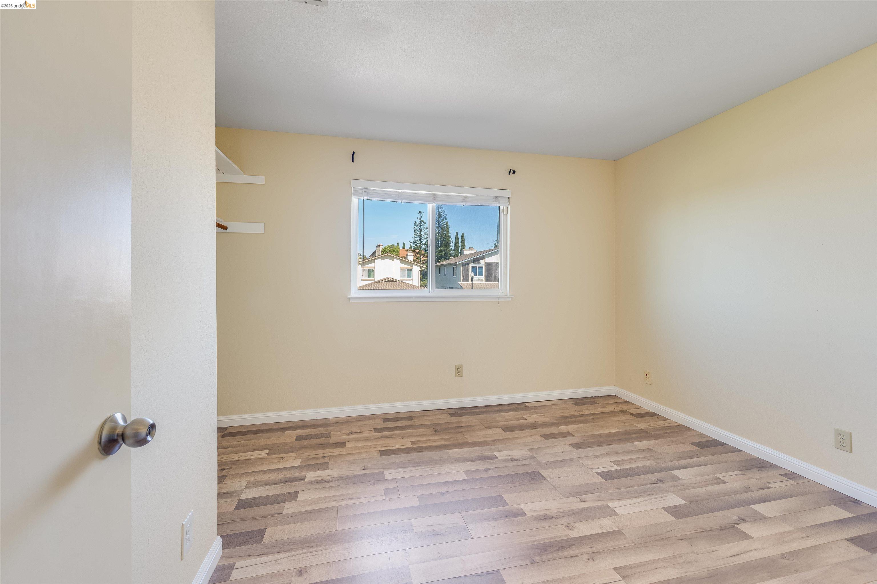 2142 Redwood Road Hercules, CA 94547 - Photo 23 of 37 Empty room with light wood-style floors and baseboards