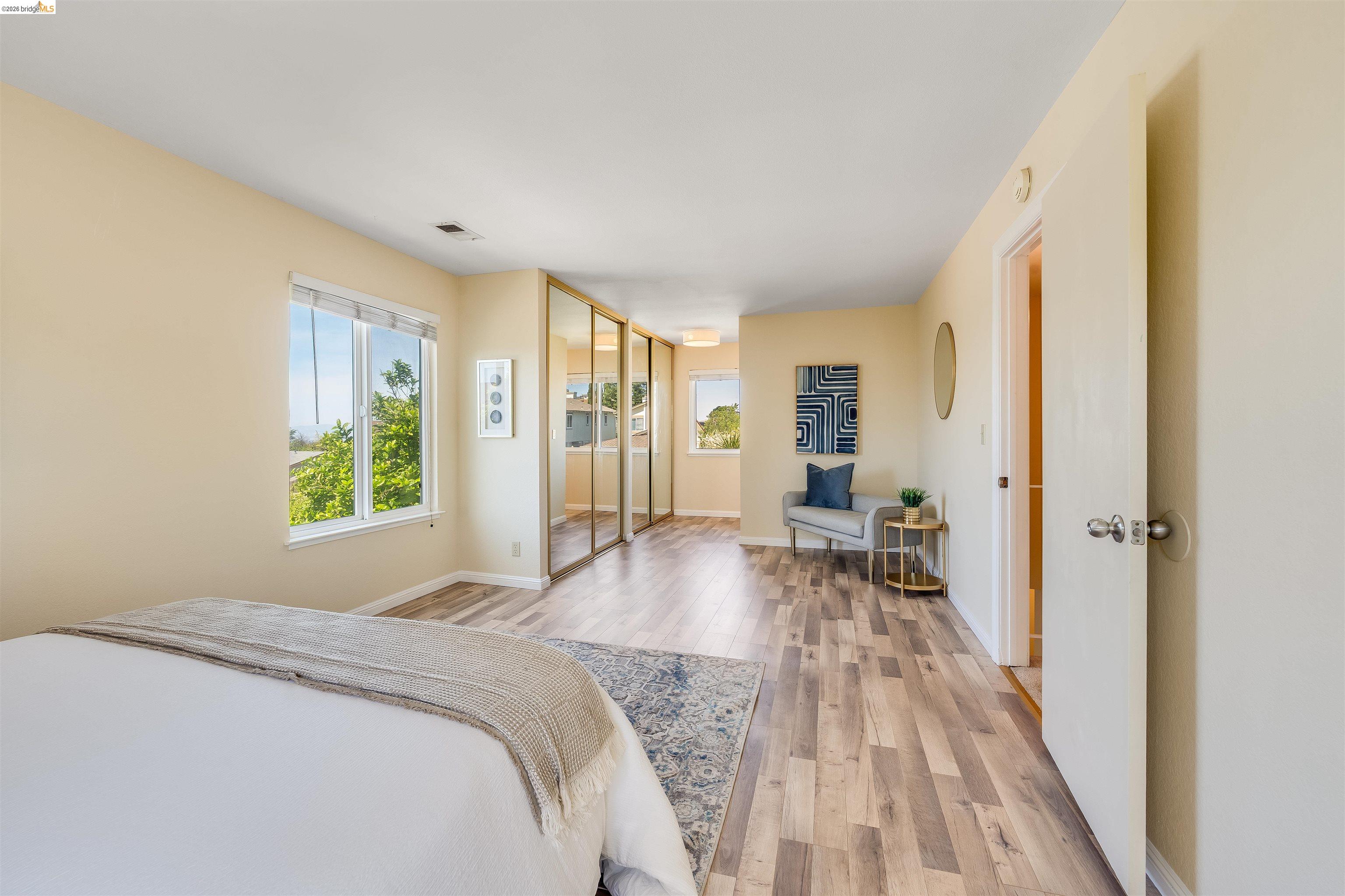 2142 Redwood Road Hercules, CA 94547 - Photo 26 of 37 Bedroom featuring light wood-type flooring, multiple windows, and a closet