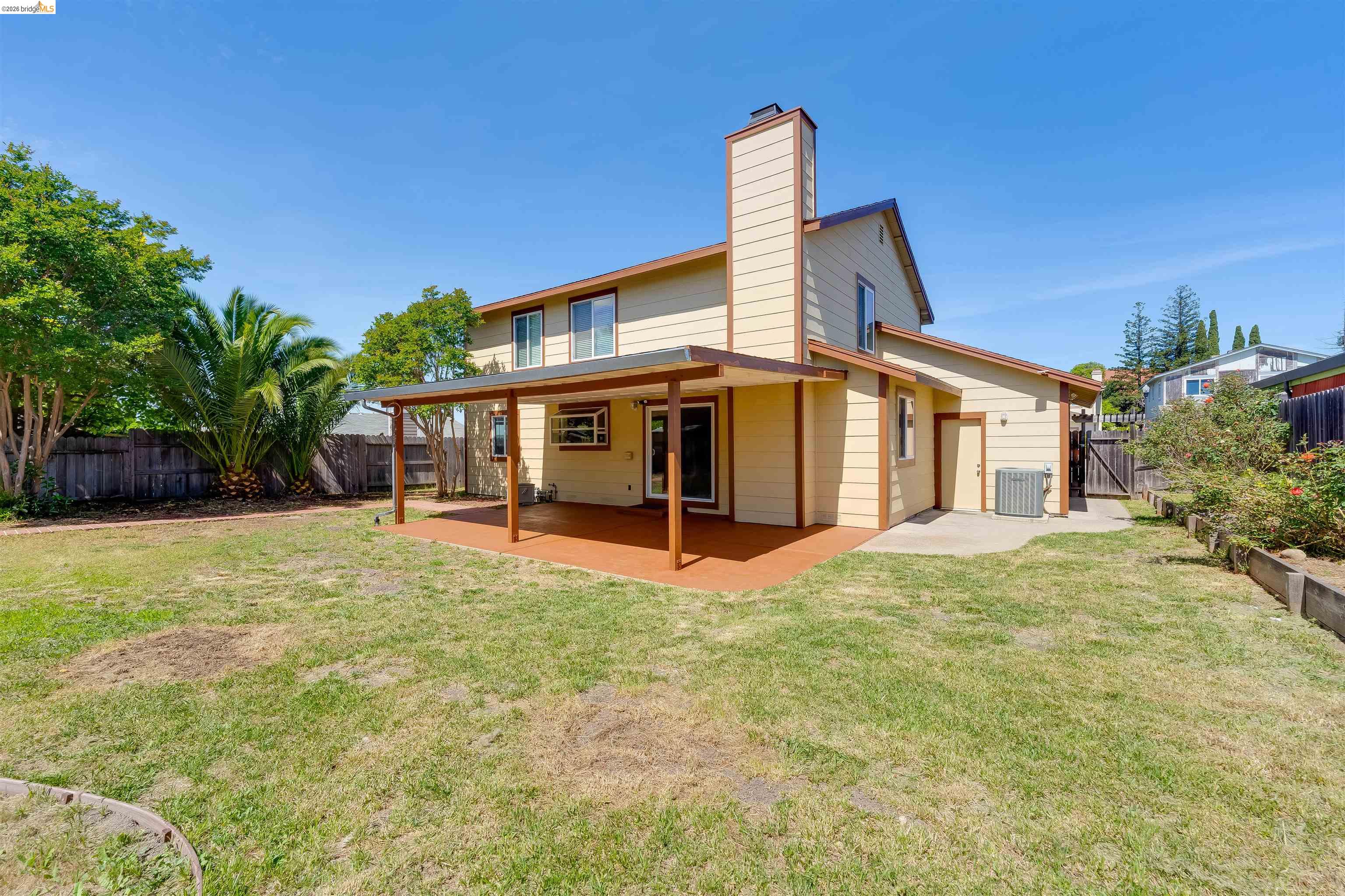2142 Redwood Road Hercules, CA 94547 - Photo 33 of 37 Back of property with a patio area, a fenced backyard, a chimney, and a gate