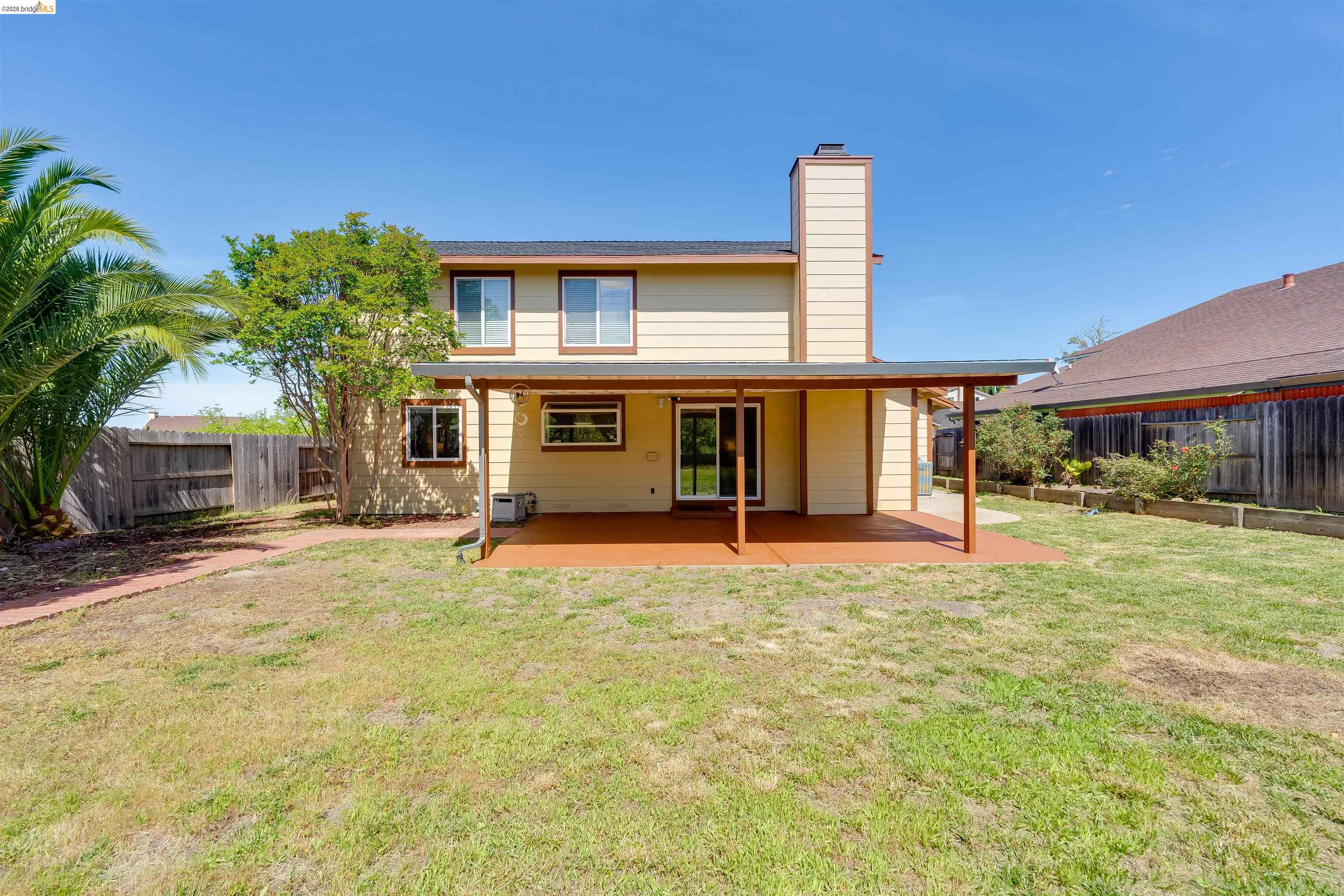 2142 Redwood Road Hercules, CA 94547 - Photo 34 of 37 Rear view of property featuring a chimney, a patio area, and a fenced backyard