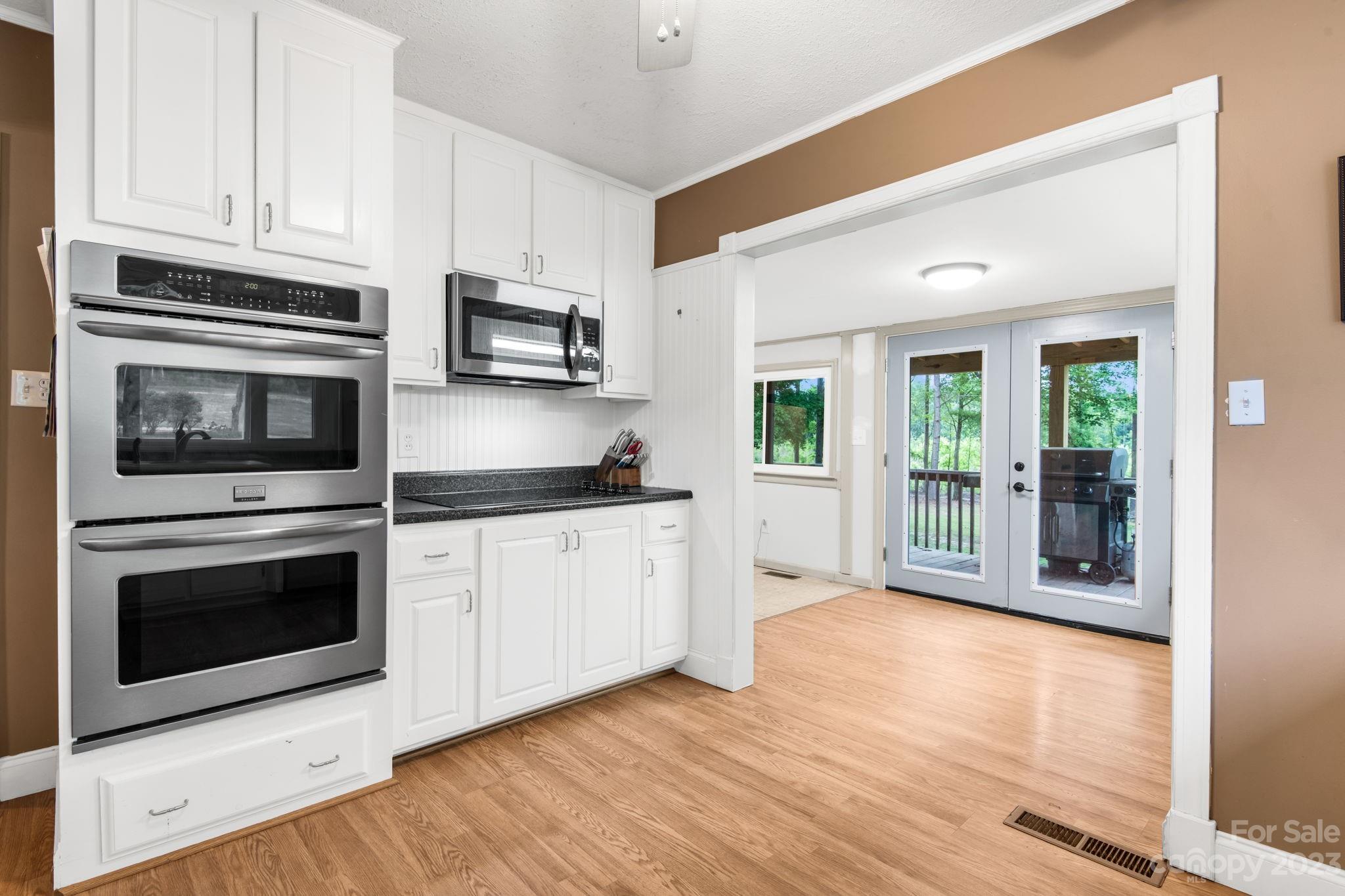 1335 Hill Road Lincolnton, NC 28092 - Photo 20 of 38 a kitchen with stainless steel appliances granite countertop a stove microwave and sink