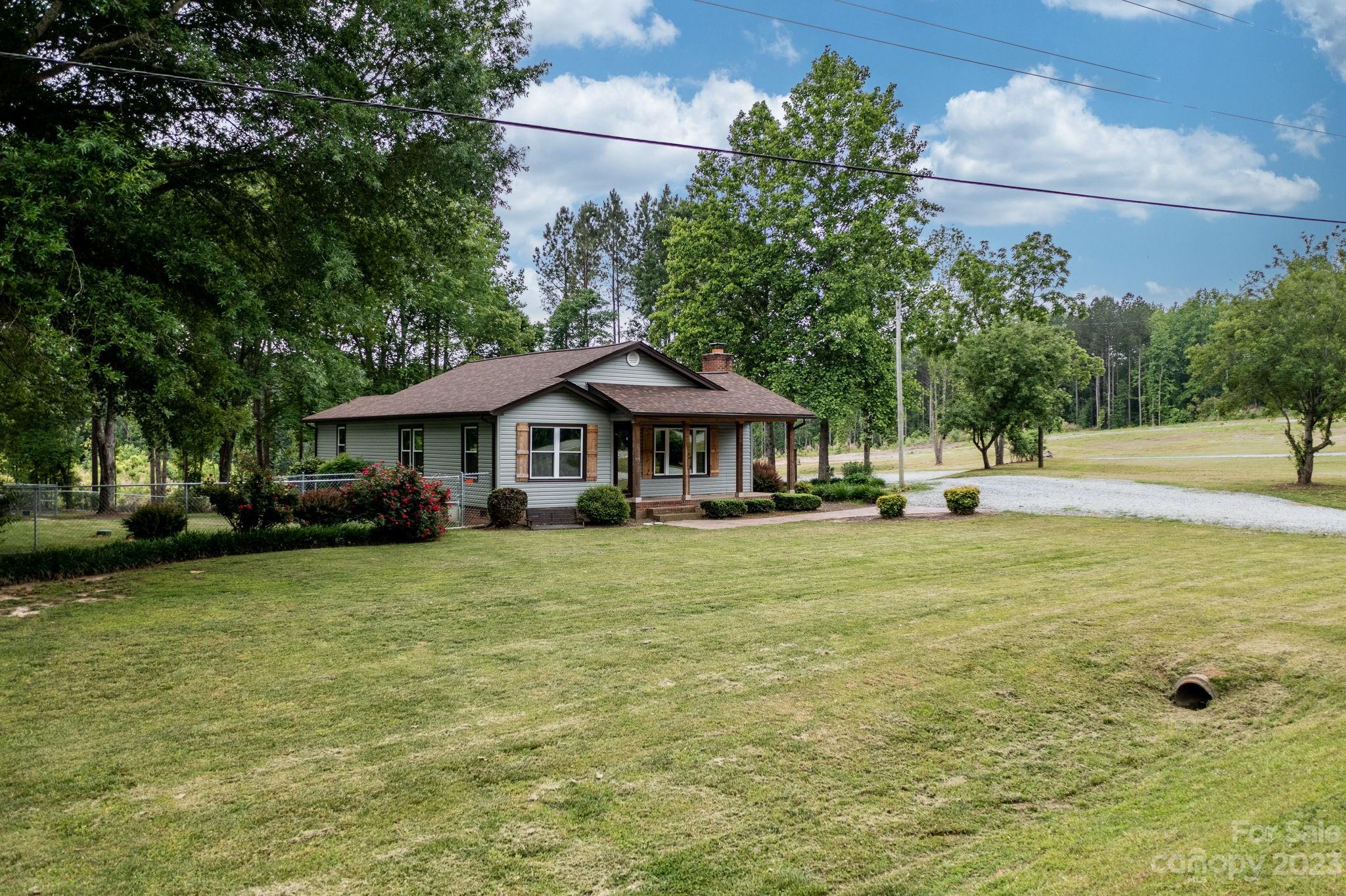 1335 Hill Road Lincolnton, NC 28092 - Photo 2 of 38 a front view of a house with garden