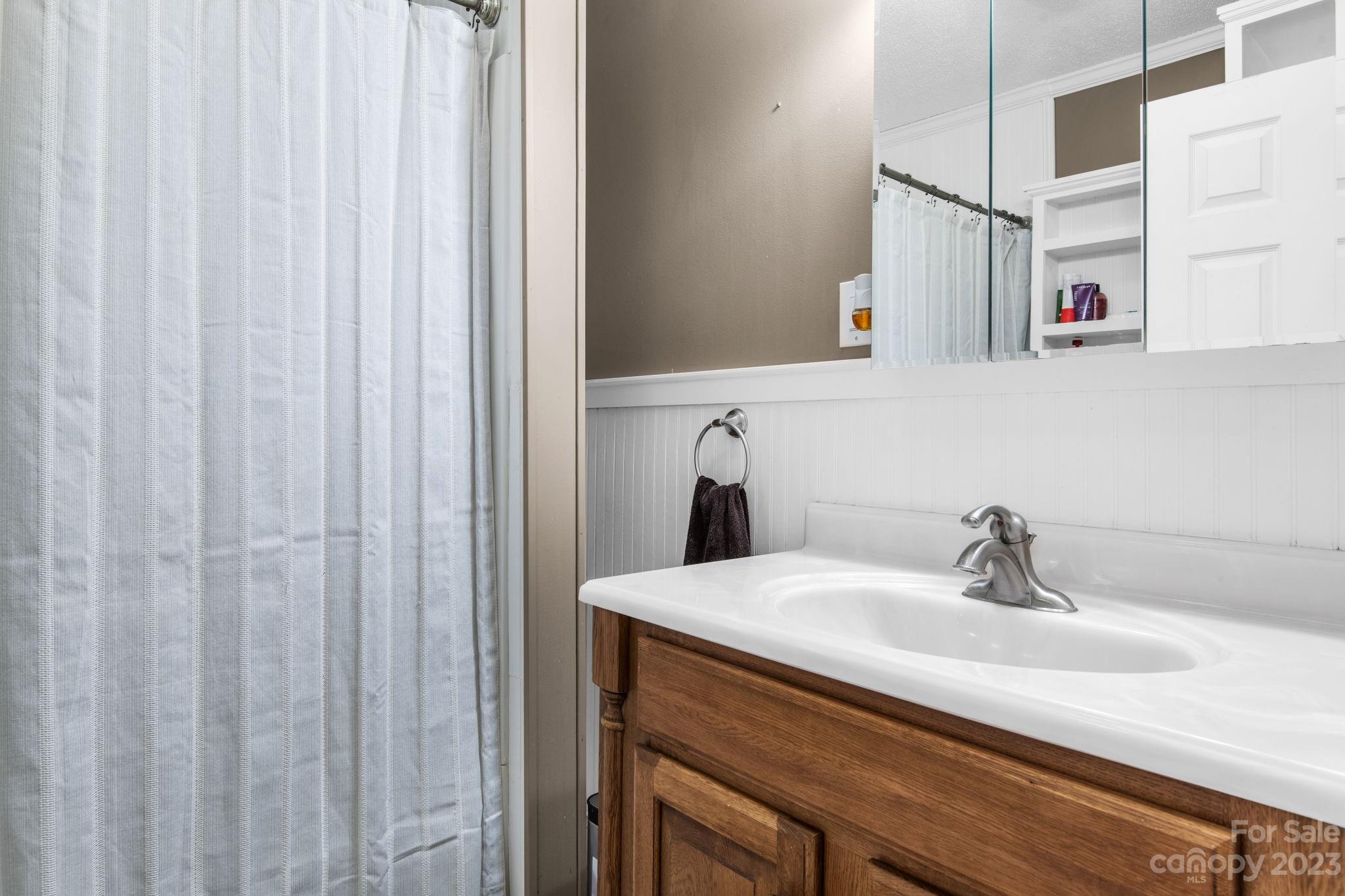 1335 Hill Road Lincolnton, NC 28092 - Photo 27 of 38 a bathroom with a sink and vanity