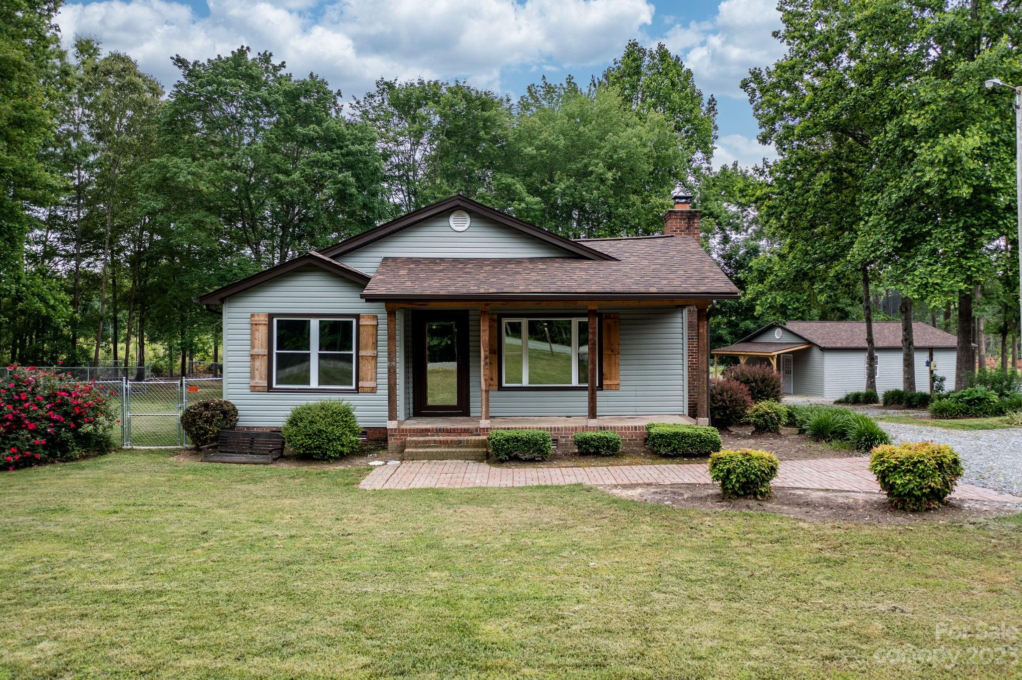 1335 Hill Road Lincolnton, NC 28092 - Photo 3 of 38 a front view of a house with a yard and porch