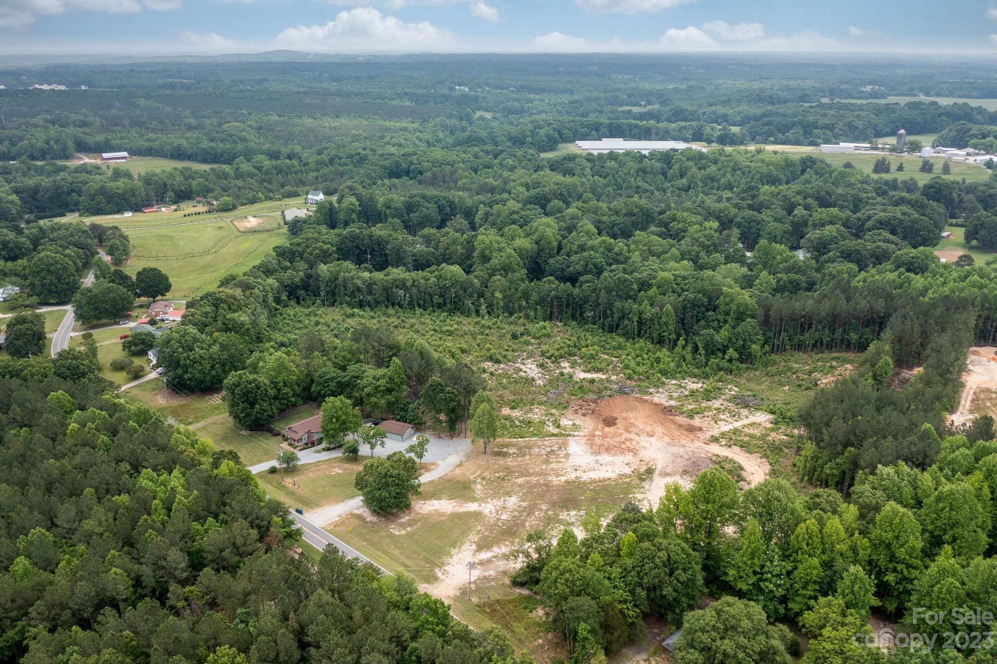1335 Hill Road Lincolnton, NC 28092 - Photo 37 of 38 a view of a lake with lots of trees