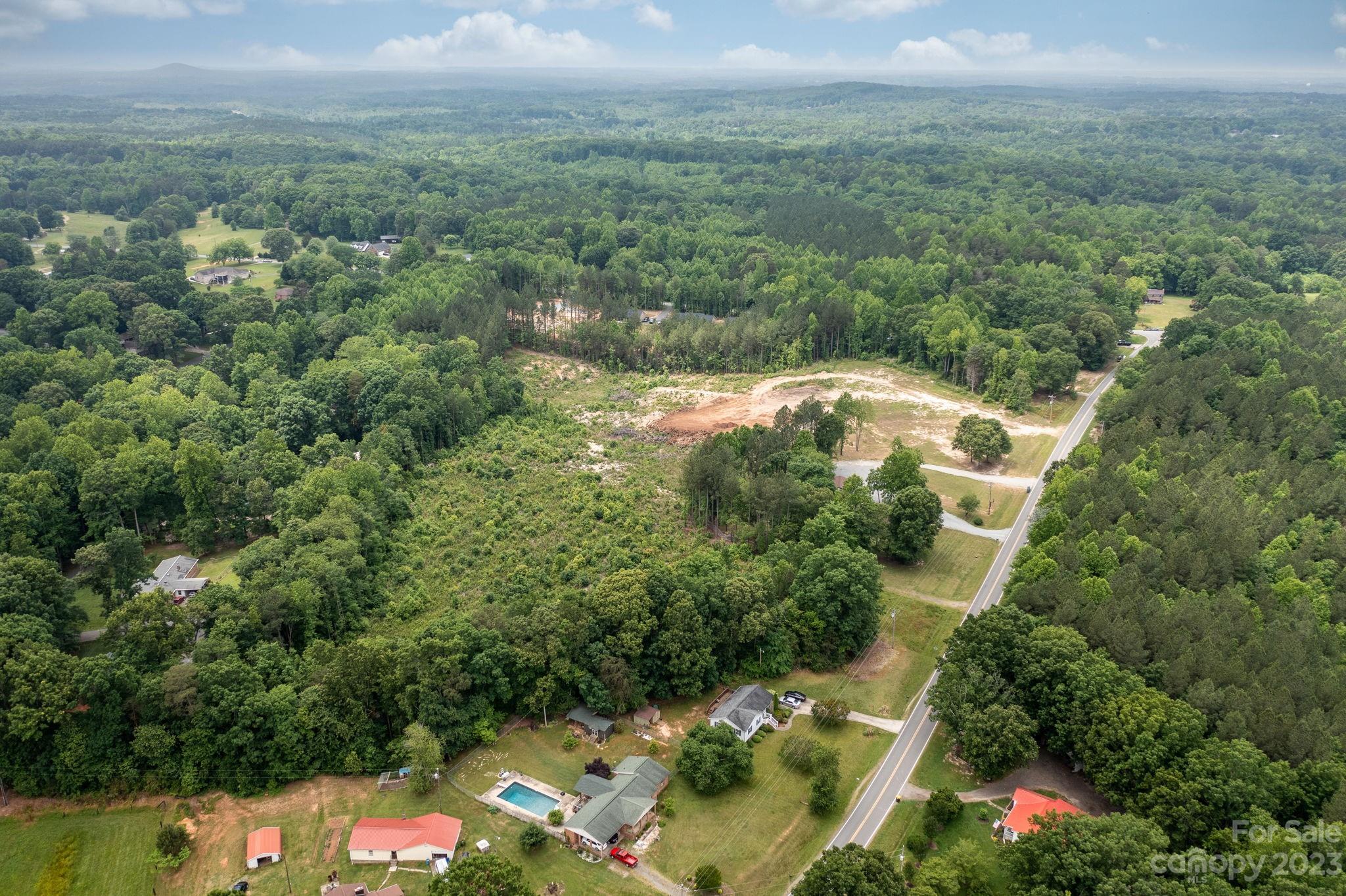 1335 Hill Road Lincolnton, NC 28092 - Photo 38 of 38 an aerial view of residential houses with outdoor space and trees