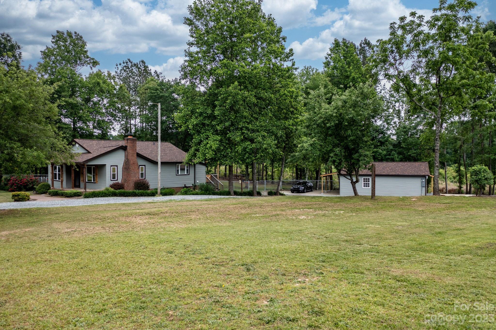 1335 Hill Road Lincolnton, NC 28092 - Photo 4 of 38 a front view of a house with a garden